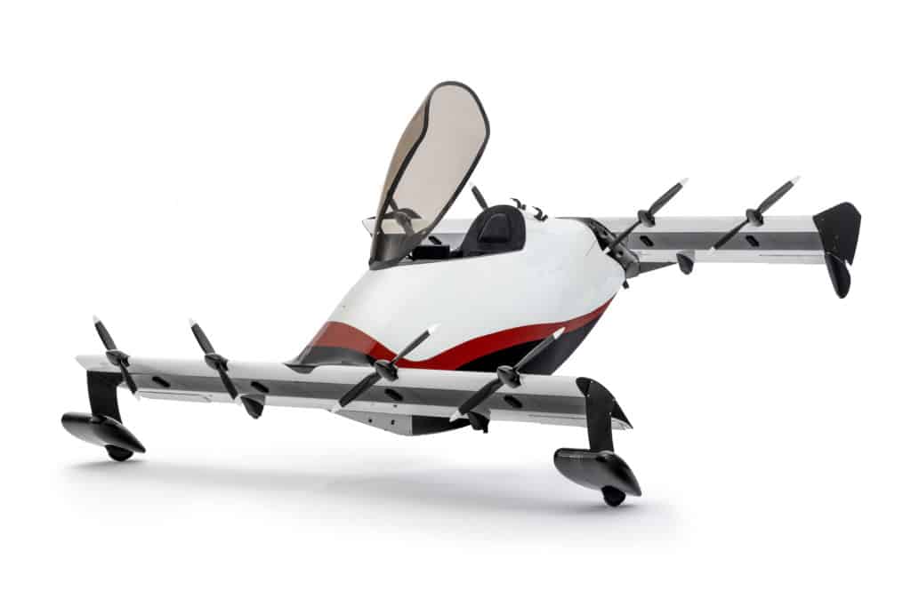 Image of Pivotal's Helix personal aircraft on a white background with it's canopy open.