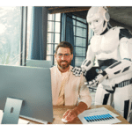 Smiling man working on a computer with a humanoid AI robot assisting him, illustrating vibe coding and AI-powered app development.